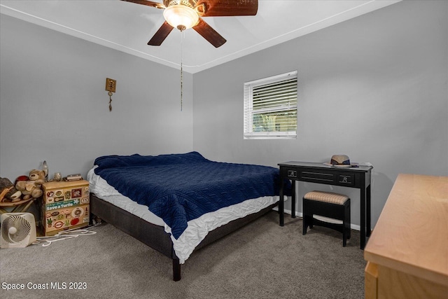 3706 Sutton Dr, Orlando, FL 32810 - bedroom featuring dark carpet, ornamental molding, and ceiling fan
