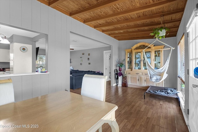 3706 Sutton Dr, Orlando, FL 32810 - dining area with dark hardwood / wood-style flooring, wooden ceiling, and beam ceiling