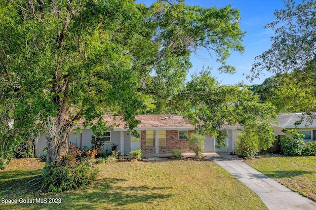 3706 Sutton Dr, Orlando, FL 32810 - view of front facade featuring a front lawn