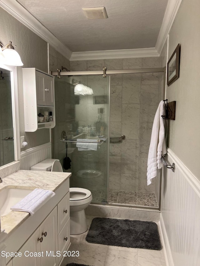 bathroom with vanity, tile floors, a shower with door, a textured ceiling, and toilet