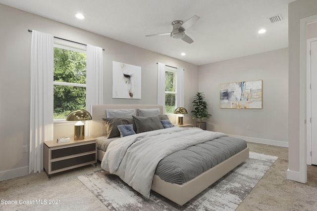 bedroom featuring multiple windows and ceiling fan