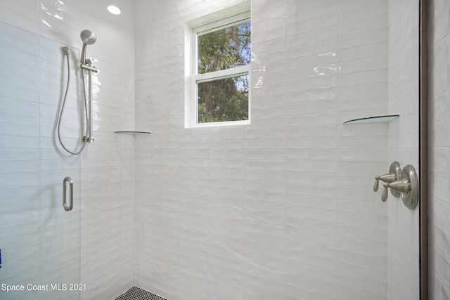 bathroom featuring an enclosed shower