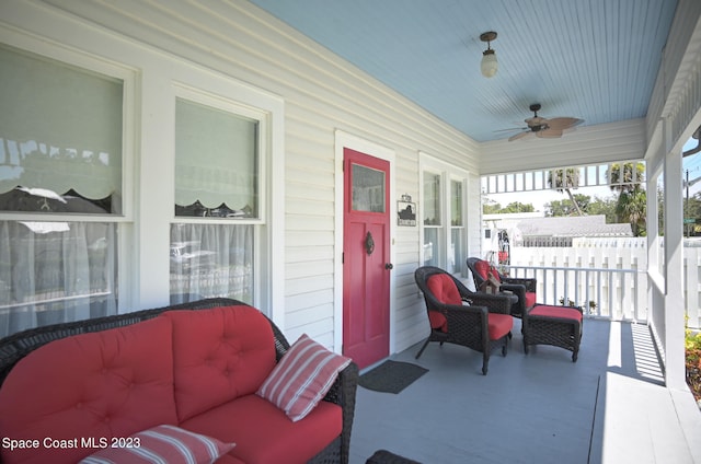 view of terrace with outdoor lounge area and ceiling fan