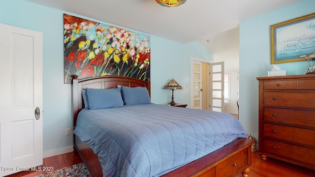 bedroom featuring dark hardwood / wood-style floors