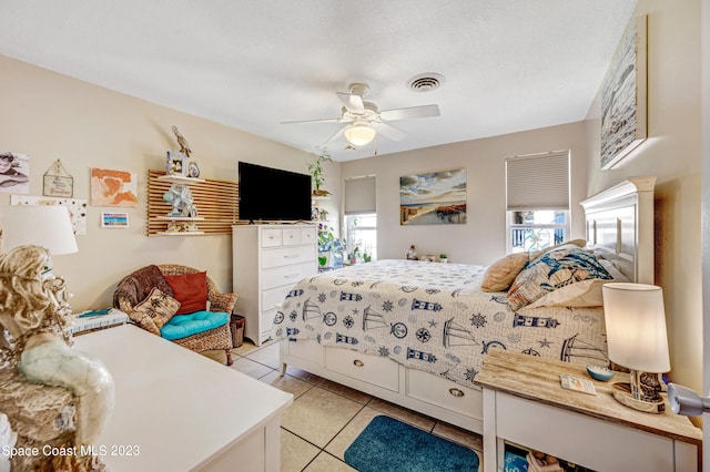 bedroom with light tile floors and ceiling fan