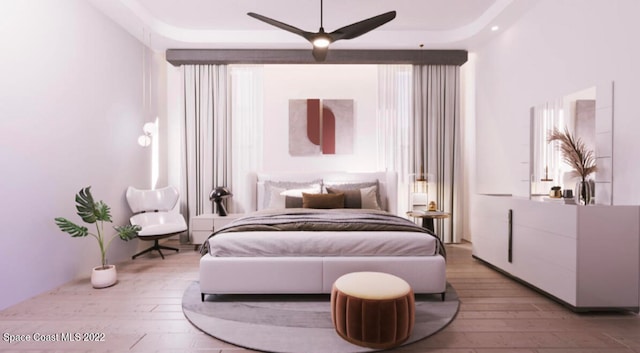 bedroom with light hardwood / wood-style floors and ceiling fan