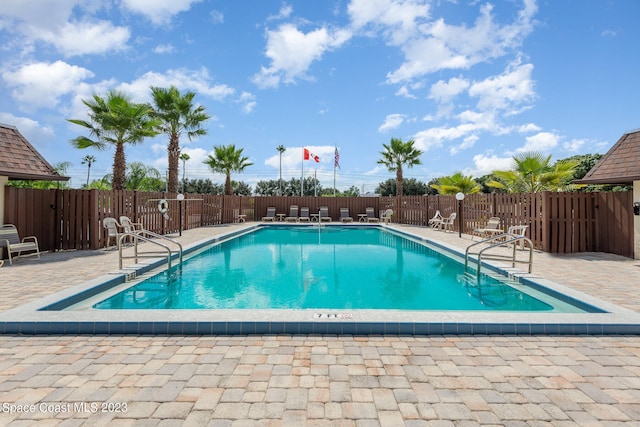 view of pool featuring a patio area