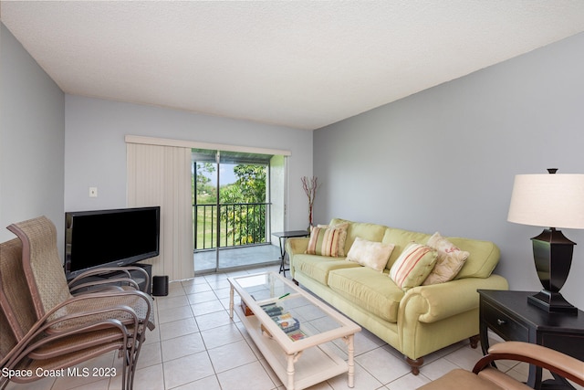 living room featuring light tile floors