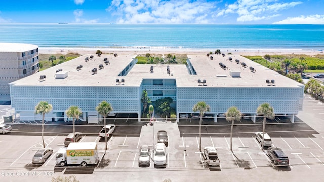 bird's eye view featuring a view of the beach and a water view