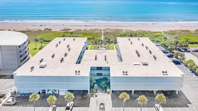 bird's eye view featuring a view of the beach and a water view