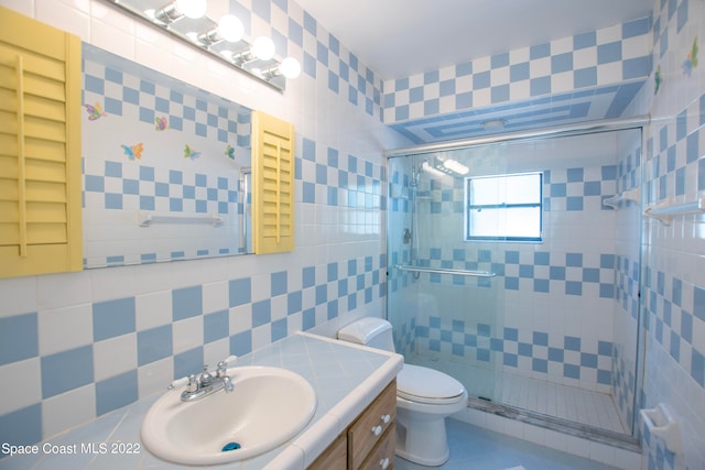 bathroom featuring an enclosed shower, toilet, and tile walls