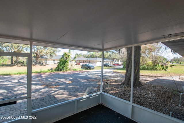 unfurnished sunroom featuring a healthy amount of sunlight