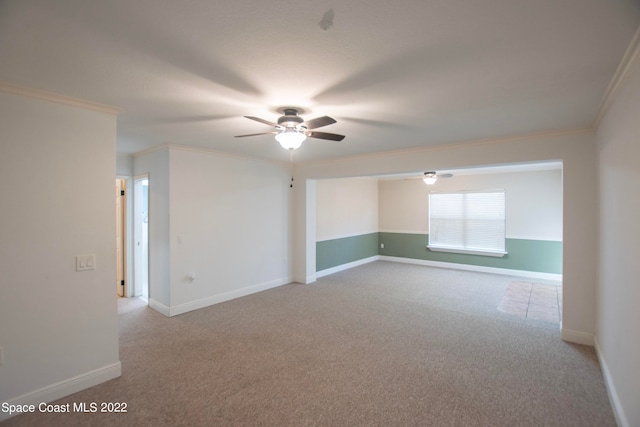 unfurnished room with light carpet, ornamental molding, and ceiling fan