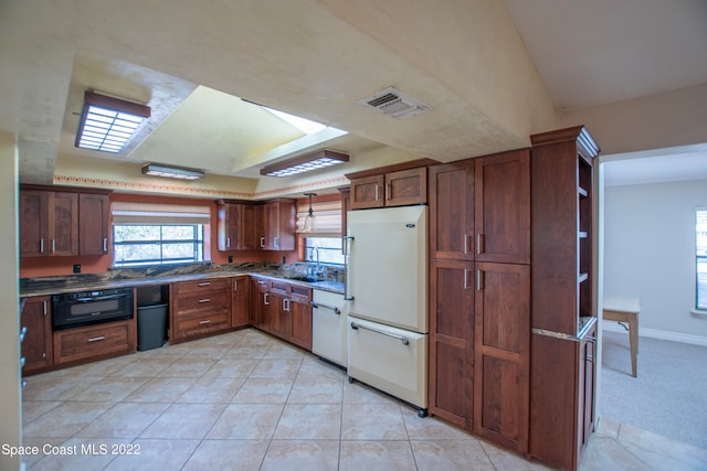 kitchen with white appliances, sink, and light tile floors