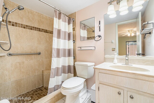 bathroom featuring toilet, tile patterned flooring, vanity, and a shower with shower curtain