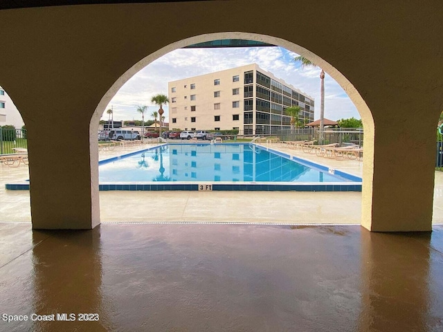 view of swimming pool with a patio