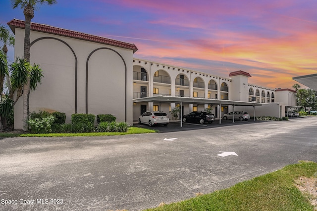 view of outdoor building at dusk