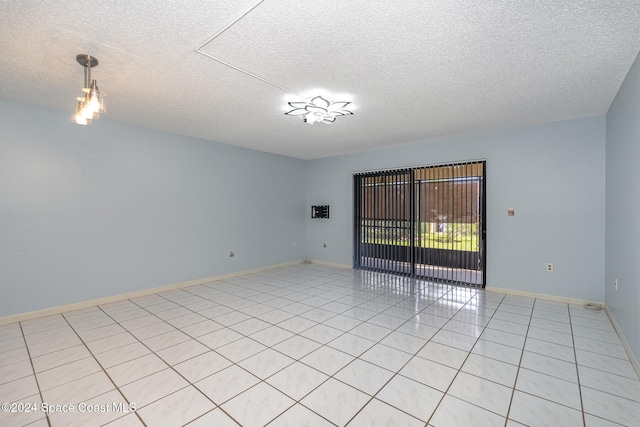 empty room with a textured ceiling