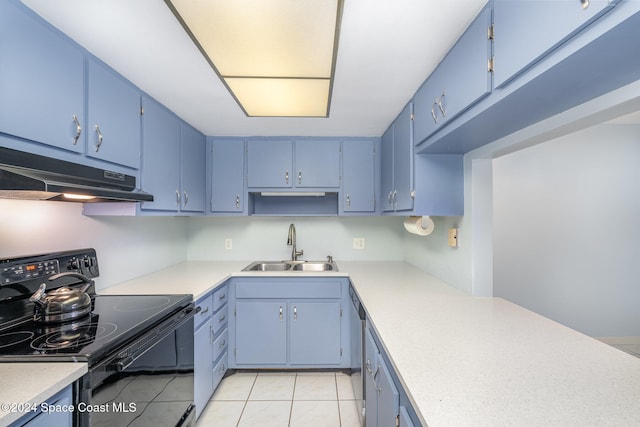 kitchen with black electric range, blue cabinetry, and sink