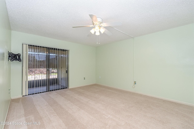 5800 N Banana River Blvd Unit 115, Cape Canaveral, FL 32920 - unfurnished room with light colored carpet, a ceiling fan, a textured ceiling, and baseboards