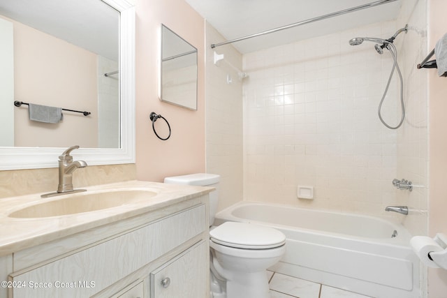 full bathroom with toilet, vanity, tiled shower / bath combo, and tile patterned floors