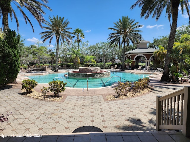 view of swimming pool with a gazebo, a patio area, and a jacuzzi