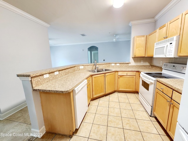 kitchen with light tile flooring, light brown cabinetry, and white appliances