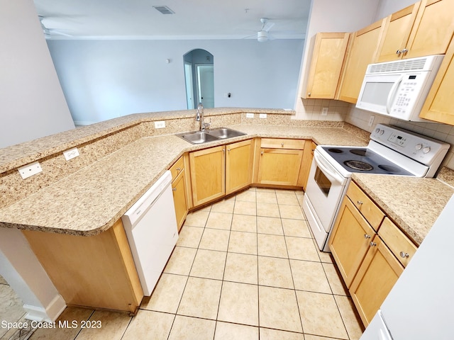 kitchen featuring white appliances, kitchen peninsula, ceiling fan, and light tile flooring