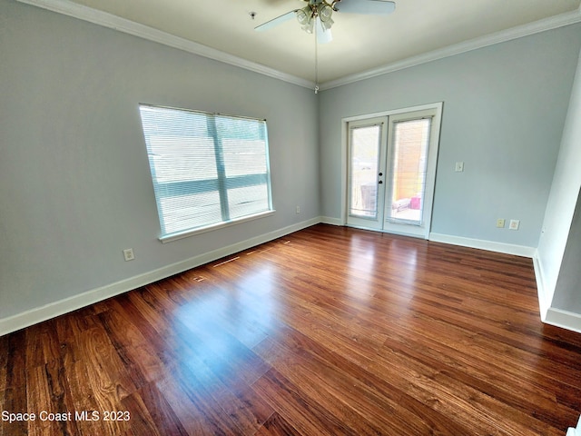 spare room featuring crown molding, french doors, dark hardwood / wood-style flooring, and ceiling fan