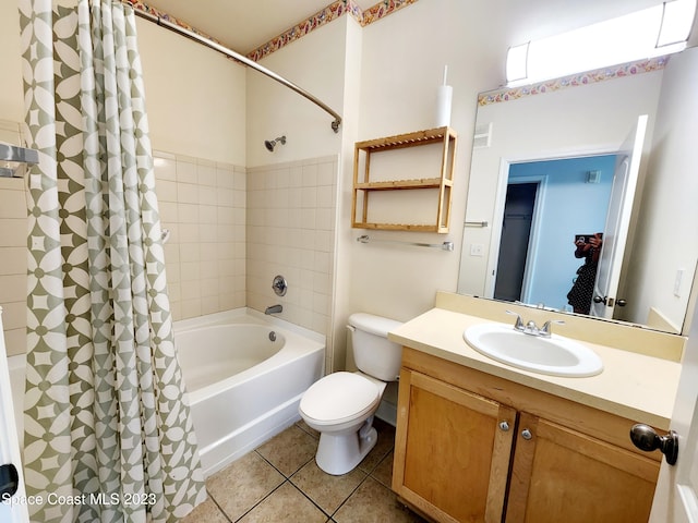 full bathroom featuring tile floors, toilet, vanity, and shower / bathtub combination with curtain