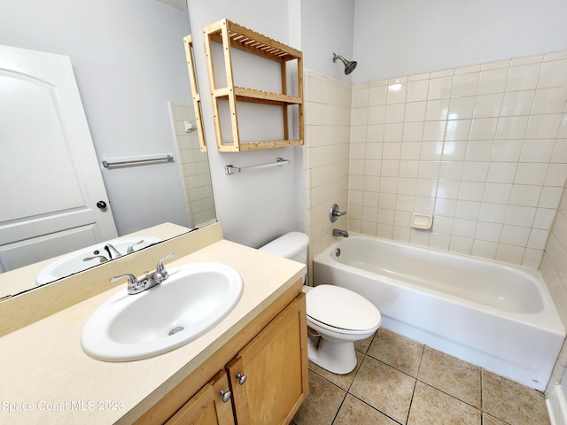 full bathroom with tiled shower / bath combo, tile flooring, oversized vanity, and toilet