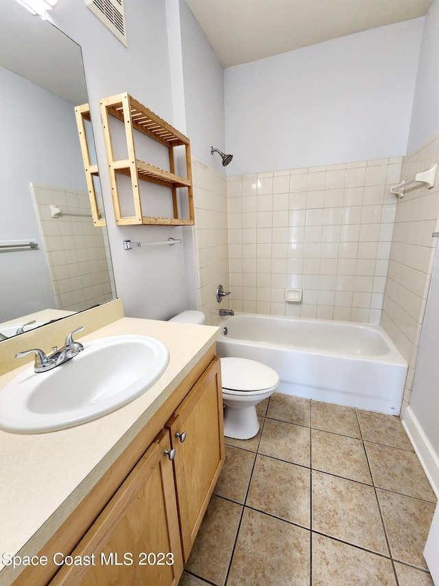 full bathroom featuring tiled shower / bath, tile flooring, and large vanity