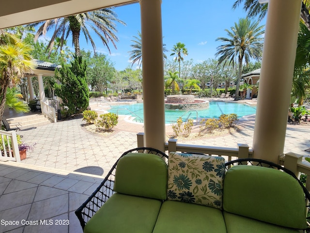 view of swimming pool featuring a patio area