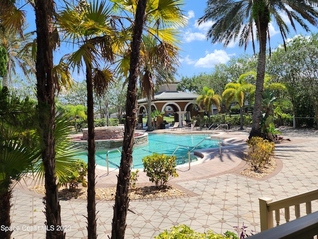 view of swimming pool featuring a patio area