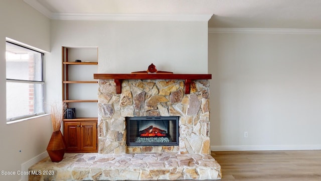 living room with a fireplace, light wood-type flooring, and crown molding