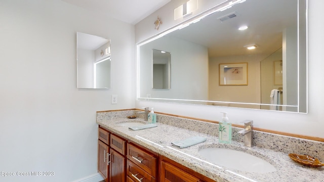 bathroom featuring double vanity