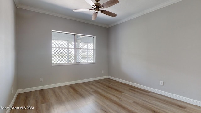 empty room with ceiling fan, light wood-type flooring, and crown molding