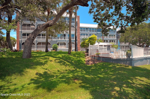 surrounding community featuring a lawn