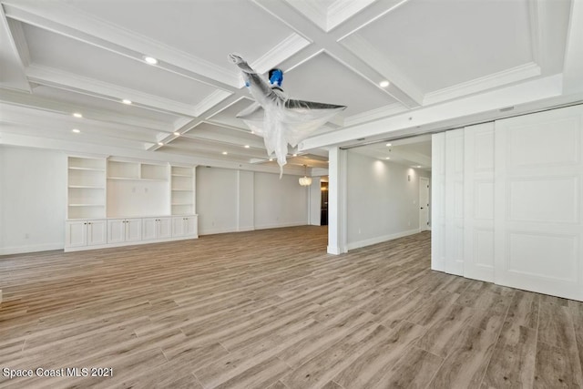 interior space with coffered ceiling, beamed ceiling, and light hardwood / wood-style flooring