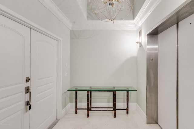 interior space with a raised ceiling, ornamental molding, and elevator