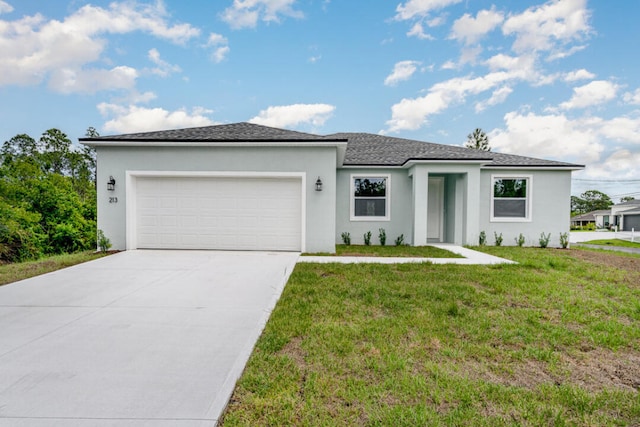 view of front of house with a garage and a front yard