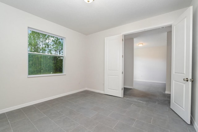 empty room with tile flooring