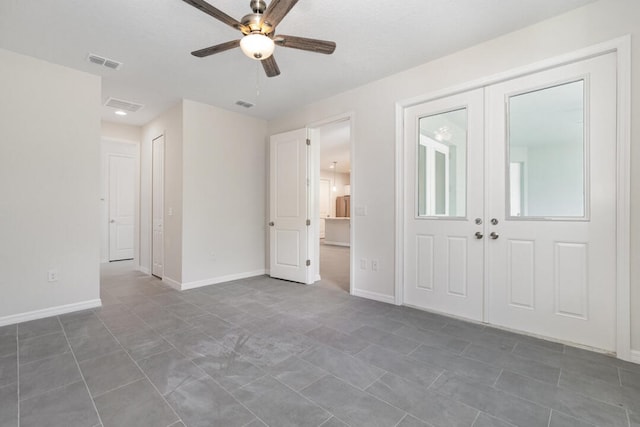 interior space featuring ceiling fan and french doors