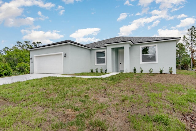 ranch-style house featuring a garage and a front lawn