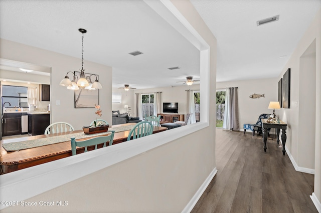 interior space featuring a notable chandelier and wood-type flooring