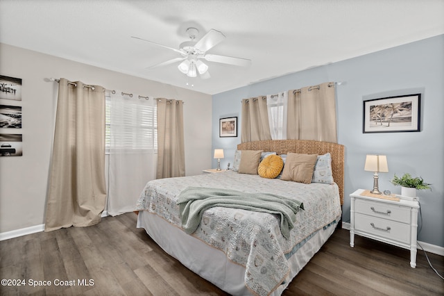 bedroom with dark wood-type flooring and ceiling fan