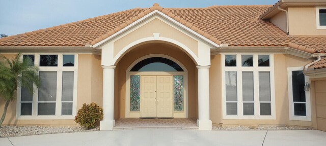 property entrance with a patio