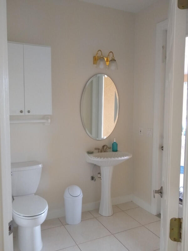 bathroom featuring tile patterned flooring and toilet