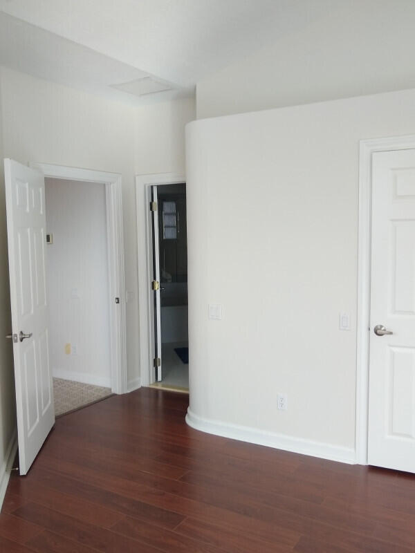 empty room featuring wood-type flooring