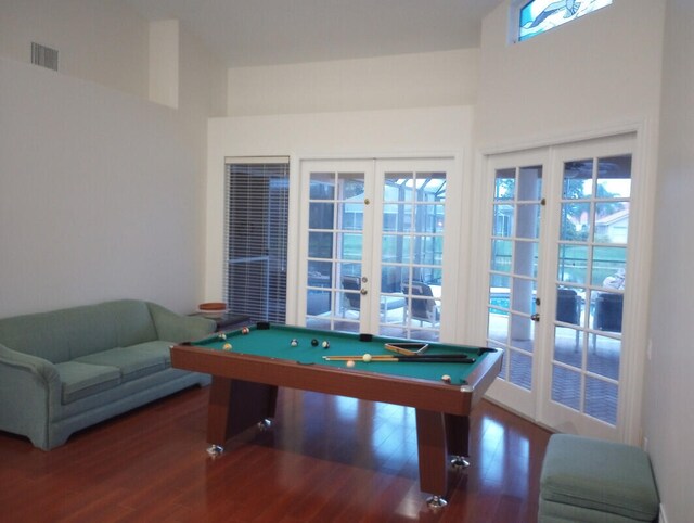 rec room with hardwood / wood-style flooring, pool table, and french doors